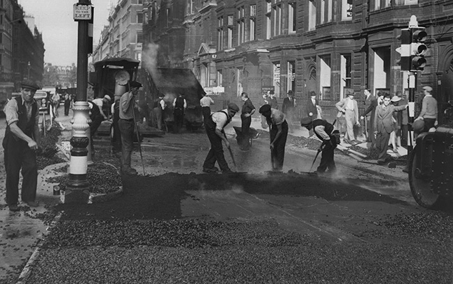 Resurfacing with 1″ sheet asphalt and pre-coated stone seal in London, England by Lunier Trinidad Company.